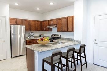 Fully-appointed designer kitchen with granite countertops